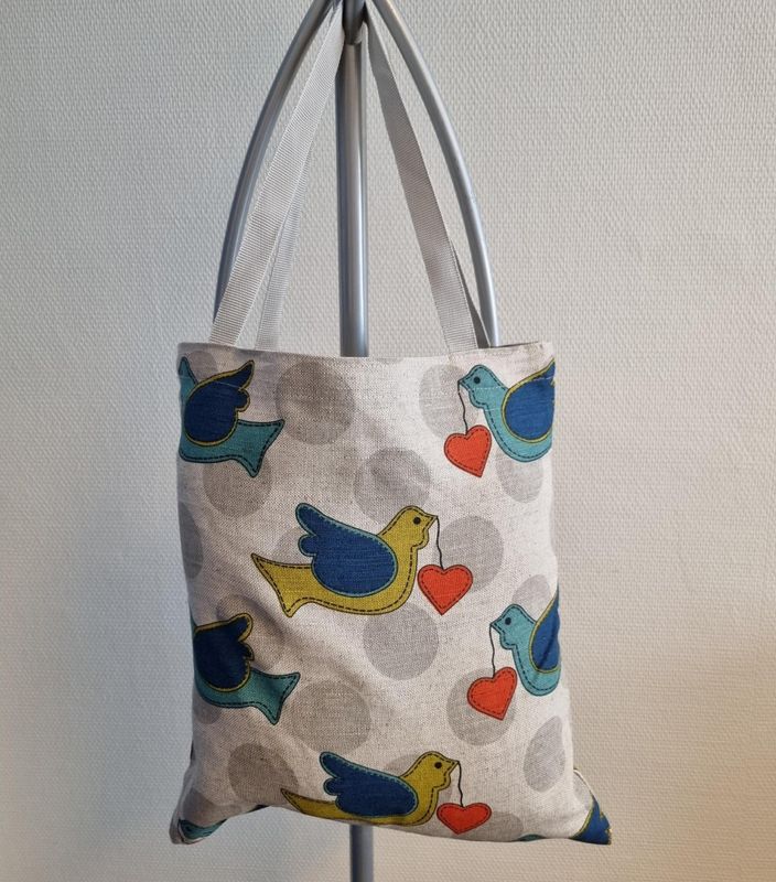 Handlenett med kjærlighetsfugler